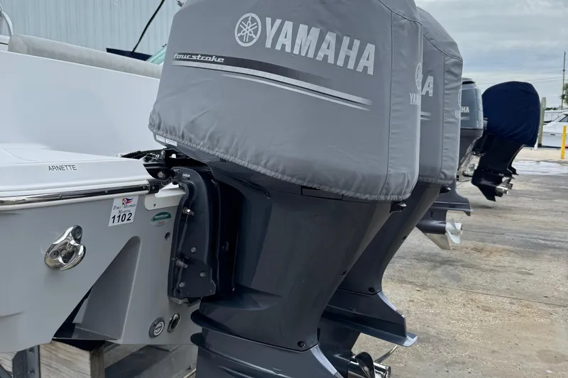 Slide: The Image of 2020 Sportsman Open 282TE Center Console with Yamaha outboard motors, docked outdoors. - 29