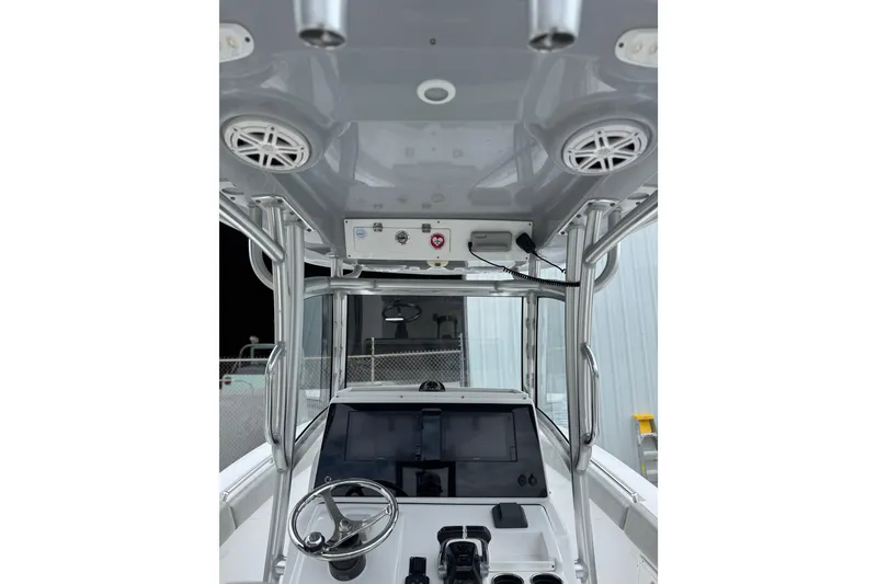 Slide: The Image of 2020 Sportsman Open 282TE Center Console boat interior with steering wheel and electronics. - 5