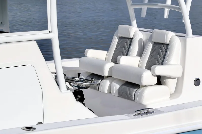 Slide: The Image of Manufacturer Provided Image: 2021 Twin Vee 280 CC GF boat with white cushioned seats and steering wheel. - 10