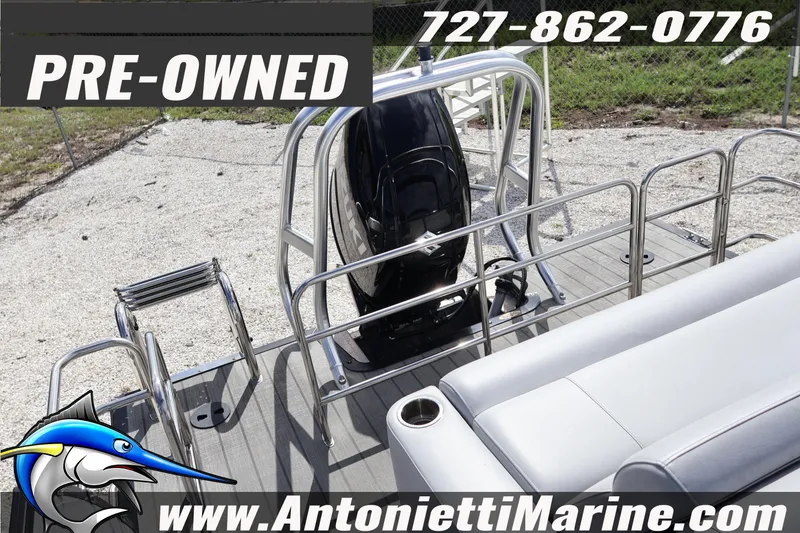 Slide: The Image of Pre-owned 2026 Bentley Pontoons Legacy 243 Swingback with outboard motor and seating. - 14