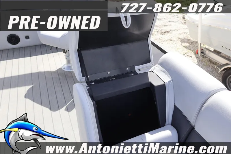Slide: The Image of Pre-owned 2026 Bentley Pontoons Legacy 243 Swingback interior seating with storage compartment. - 17