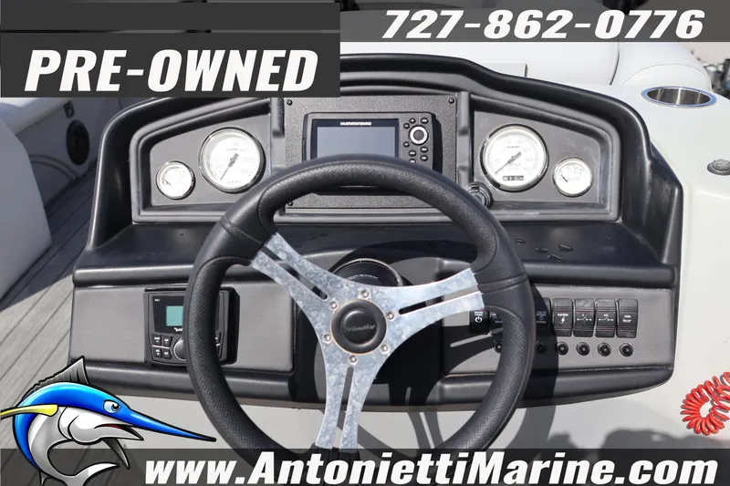 Slide: The Image of Pre-owned 2026 Bentley Pontoons Legacy 243 Swingback dashboard with steering wheel and gauges. - 9