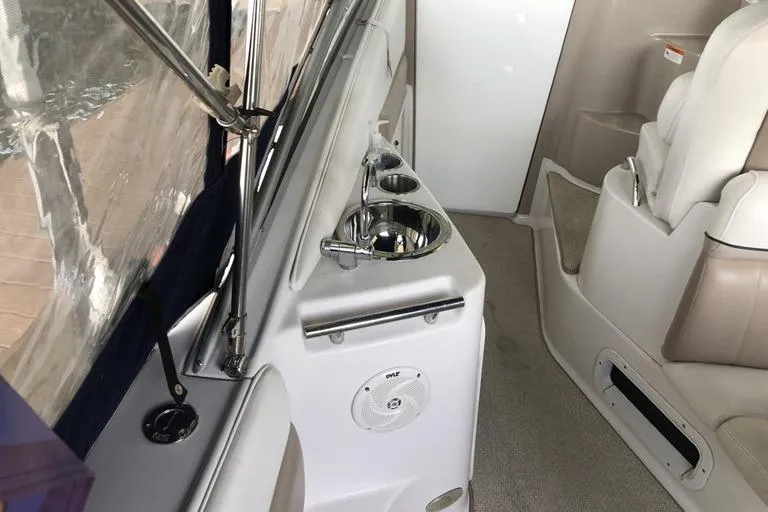 Slide: The Image of Interior of 2006 Four Winns 258 Vista boat with sink and seating area. - 5