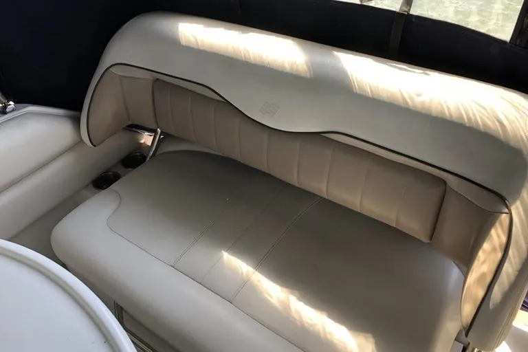 Slide: The Image of 2006 Four Winns 258 Vista boat interior with beige leather seating. - 7