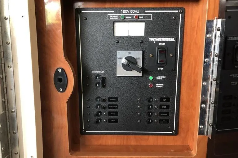Slide: The Image of Control panel of a 2006 Four Winns 258 Vista boat, featuring power switches and indicators. - 9