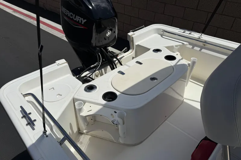 Slide: The Image of 2019 Boston Whaler 150 Montauk boat interior with Mercury engine. - 16