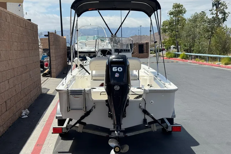 Slide: The Image of 2019 Boston Whaler 150 Montauk boat with Mercury 60 engine on trailer. - 4