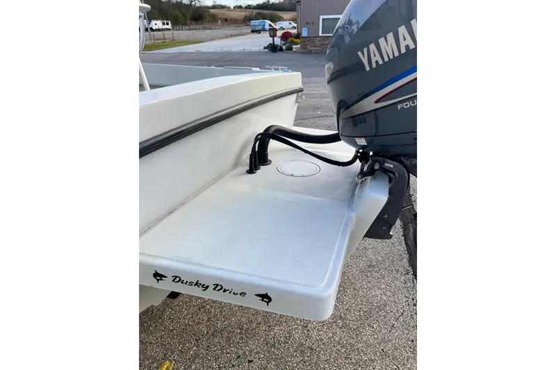 Slide: The Image of 2010 Dusky 256 Center Console boat with Yamaha outboard motor, rear view. - 11