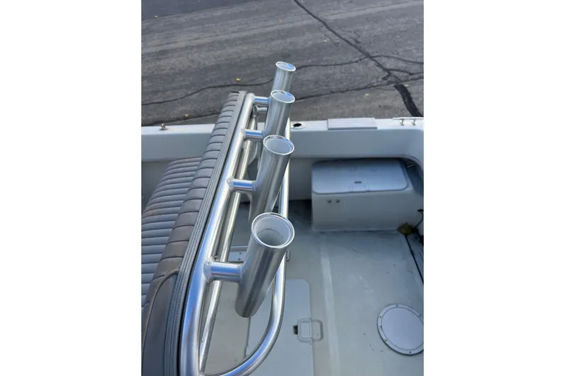 Slide: The Image of 2010 Dusky 256 Center Console boat with rod holders and seating. - 15