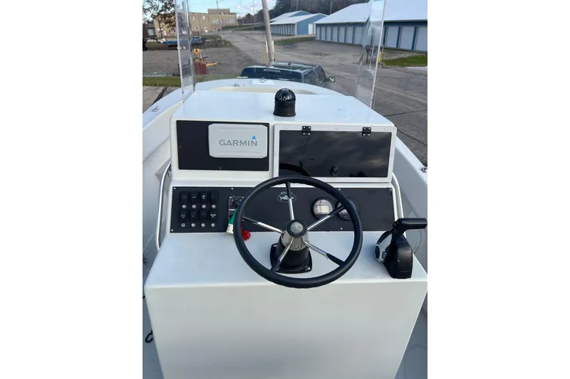 Slide: The Image of Dusky 256 Center Console 2010 boat helm with Garmin navigation system. - 21
