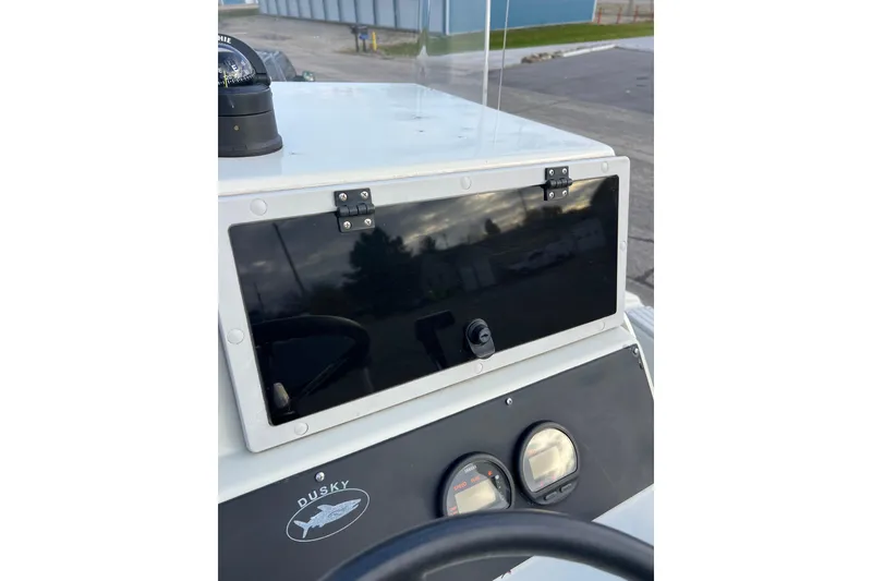 Slide: The Image of Dusky 256 Center Console 2010 dashboard with compass and gauges. - 26