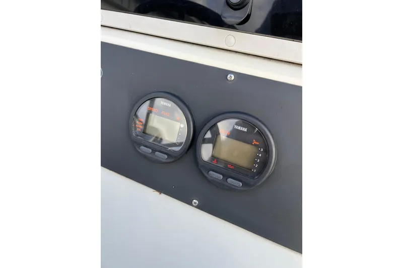Slide: The Image of Yamaha gauges on 2010 Dusky 256 Center Console boat dashboard. - 28