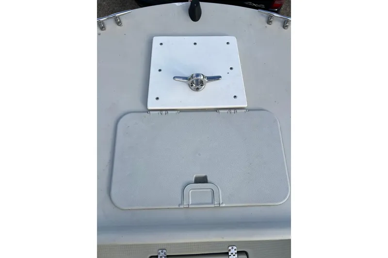 Slide: The Image of Dusky 256 Center Console 2010 boat deck with hatch and cleat. - 42