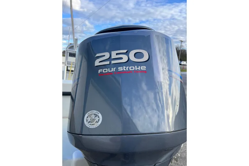 Slide: The Image of Outboard motor on a 2010 Dusky 256 Center Console boat, 250 horsepower, four-stroke engine. - 9