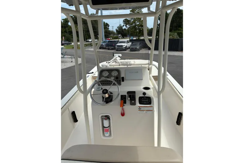 Slide: The Image of 2020 Carolina Skiff 23LS boat console with steering wheel and controls. - 3