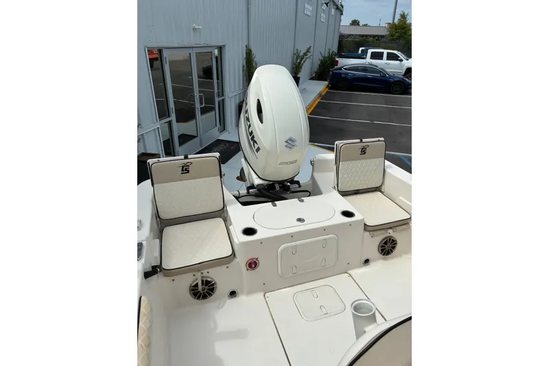 Slide: The Image of 2020 Carolina Skiff 23LS boat with Suzuki outboard motor in parking lot. - 4