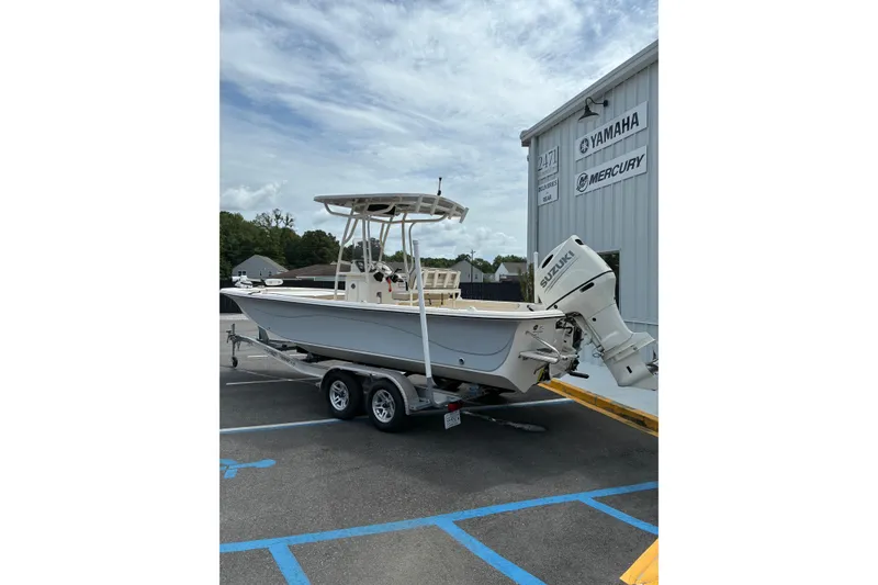 Slide: The Image of 2020 Carolina Skiff 23LS boat on trailer, parked near dealership. - 8