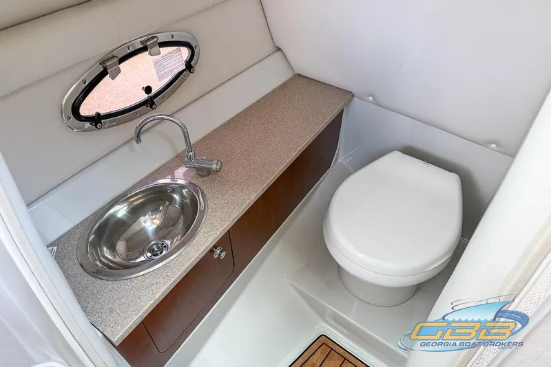 Slide: The Image of 2015 Crownline Eclipse E6 boat bathroom with sink and toilet. - 14