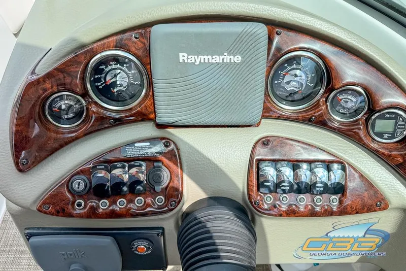 Slide: The Image of 2015 Crownline Eclipse E6 dashboard with Raymarine system and gauges. - 19