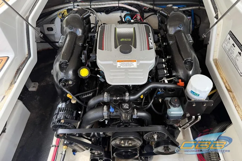 Slide: The Image of Engine compartment of a 2015 Crownline Eclipse E6 boat, showcasing the 350 MAG engine. - 20