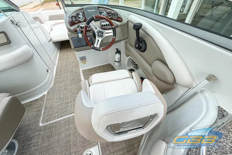 Slide: The Image of 2015 Crownline Eclipse E6 boat interior with steering wheel and dashboard controls. - 21