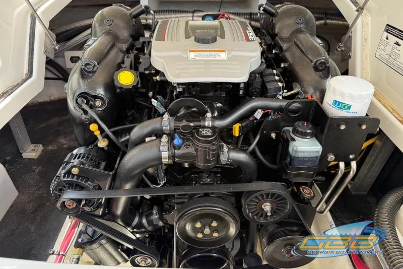 Slide: The Image of 2015 Crownline Eclipse E6 engine compartment with visible components and branding. - 22