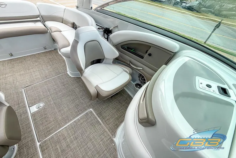 Slide: The Image of Interior of a 2015 Crownline Eclipse E6 boat with beige seating and carpet. - 26