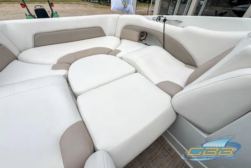 Slide: The Image of Luxurious seating in 2015 Crownline Eclipse E6 boat, featuring beige and white upholstery. - 27