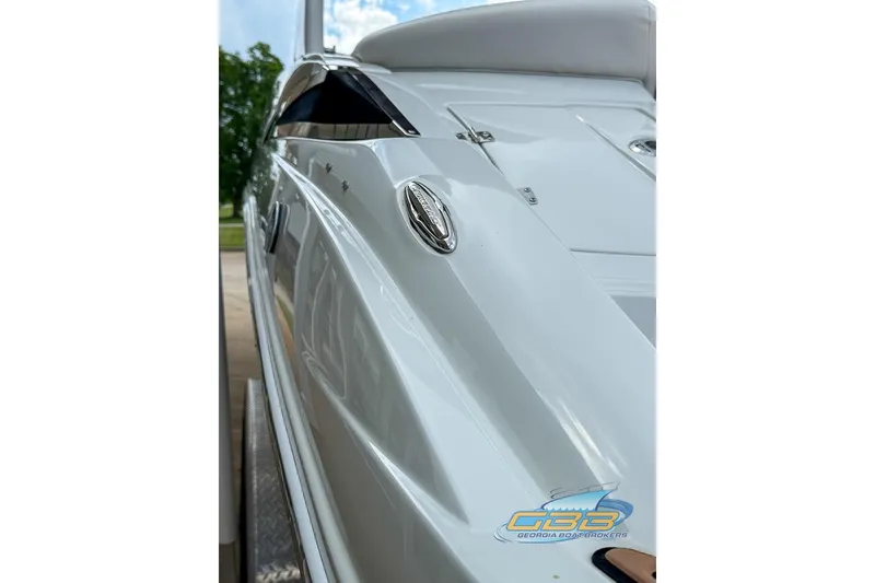 Slide: The Image of 2015 Crownline Eclipse E6 boat side view, showcasing sleek design and chrome details. - 31