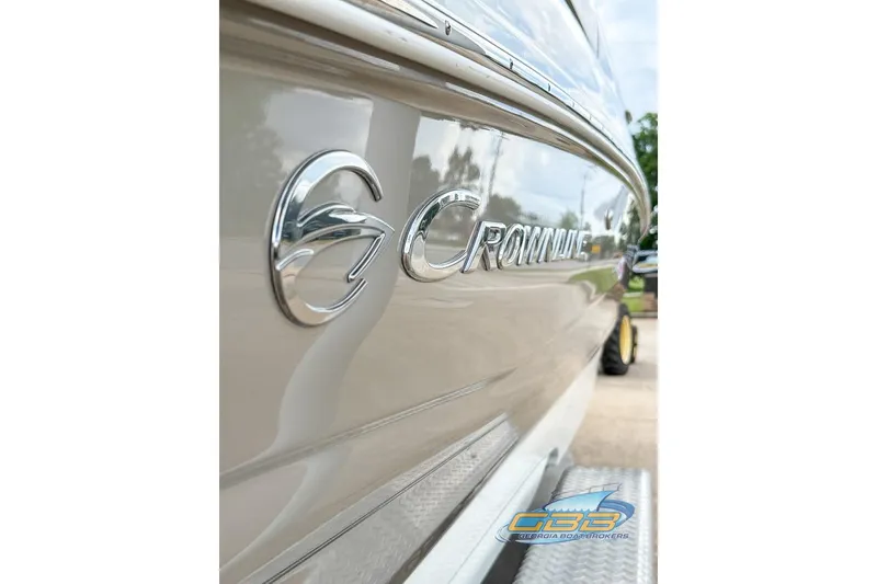 Slide: The Image of 2015 Crownline Eclipse E6 boat side view with logo and reflection. - 32