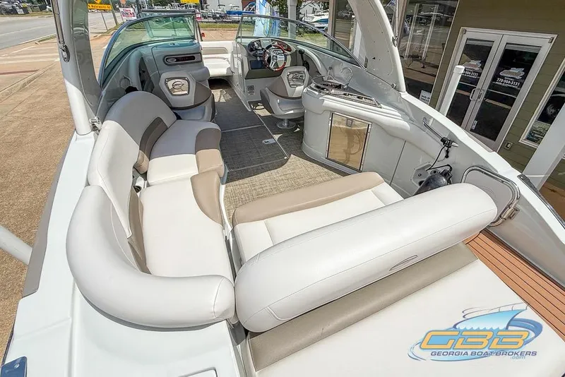 Slide: The Image of 2015 Crownline Eclipse E6 boat interior with plush seating and modern dashboard. - 4