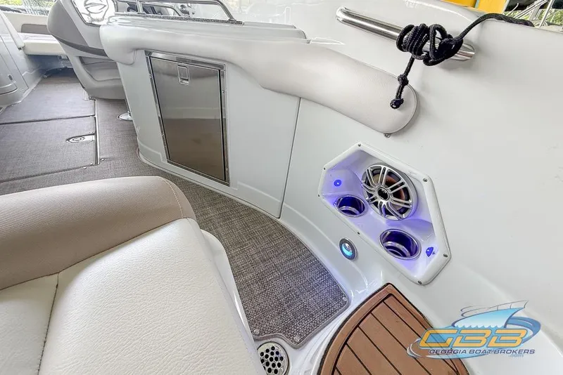 Slide: The Image of Interior of 2015 Crownline Eclipse E6 boat with speaker and seating area. - 44