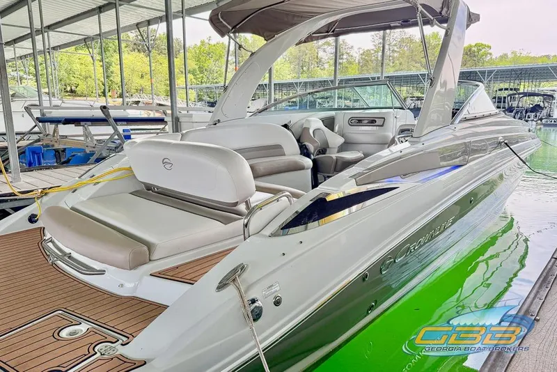 Slide: The Image of 2015 Crownline Eclipse E6 boat docked, featuring sleek design and spacious seating. - 47