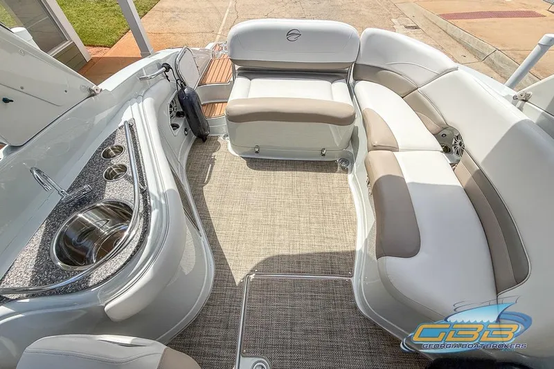 Slide: The Image of 2015 Crownline Eclipse E6 boat interior with seating and sink, featuring elegant design. - 5