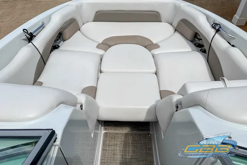 Slide: The Image of 2015 Crownline Eclipse E6 boat interior with white and beige seating. - 6
