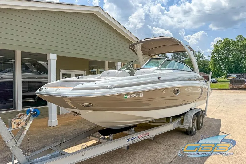 Slide: The Image of 2015 Crownline Eclipse E6 boat on trailer outside dealership, sunny day. - 7