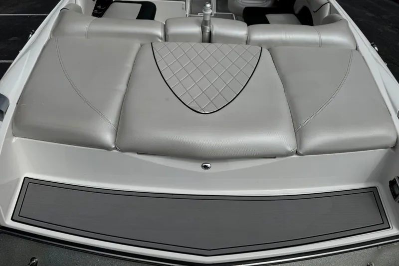 Slide: The Image of 2014 MasterCraft X-35 boat with luxurious gray seating and diamond-patterned upholstery. - 10
