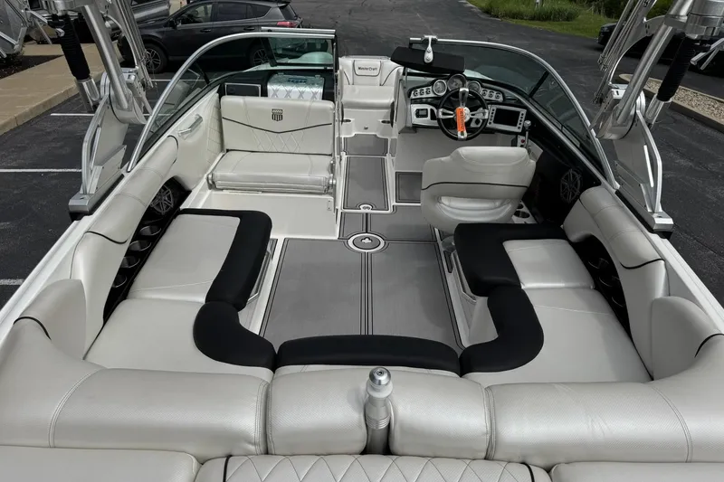 Slide: The Image of 2014 MasterCraft X-35 boat interior with luxurious seating and modern dashboard. - 11