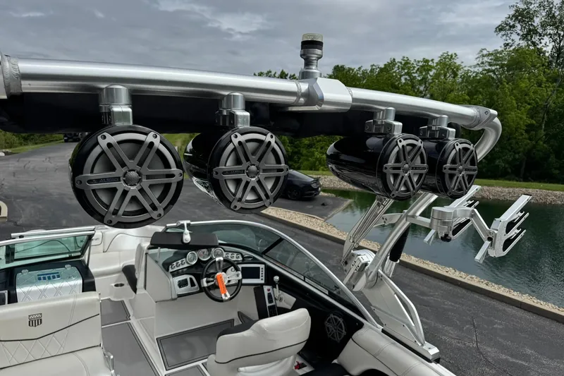 Slide: The Image of 2014 MasterCraft X-35 boat with tower speakers and sleek interior design. - 12