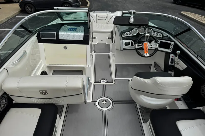 Slide: The Image of Interior of a 2014 MasterCraft X-35 boat with sleek, modern design and luxurious seating. - 23
