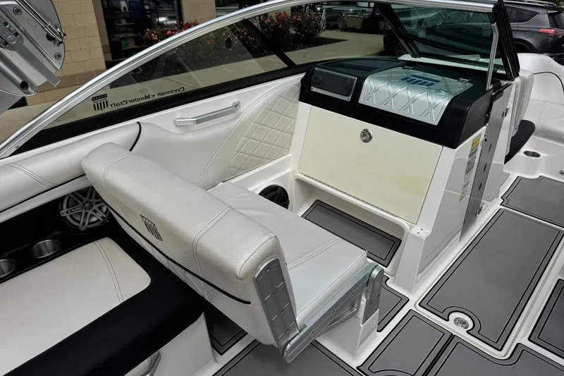Slide: The Image of 2014 MasterCraft X-35 boat interior with white seating and modern dashboard design. - 24