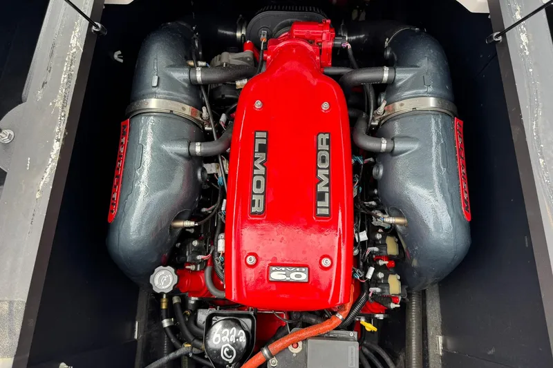 Slide: The Image of 2014 MasterCraft X-35 Ilmor engine with red cover and dual exhaust manifolds. - 26