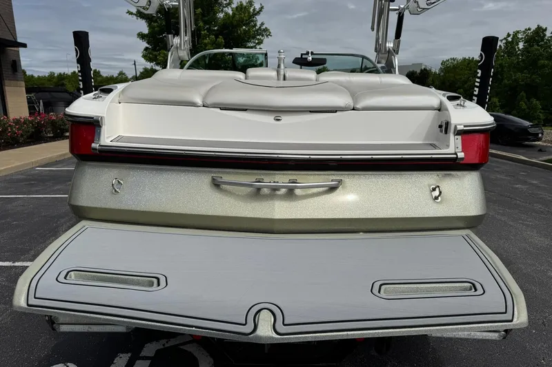 Slide: The Image of 2014 MasterCraft X-35 boat rear view with swim platform in parking lot. - 9