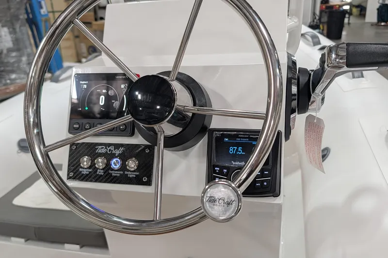 Slide: The Image of Steering console of 2026 Tide Craft Catalina 13 boat with modern controls and displays. - 3