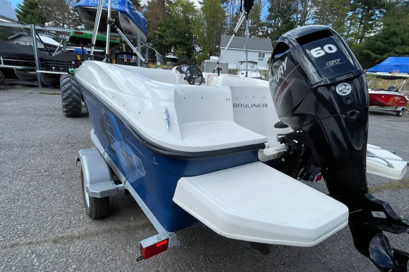 Slide: The Image of 2019 Bayliner Element E16 boat with Mercury 60 GT outboard motor on trailer. - 16