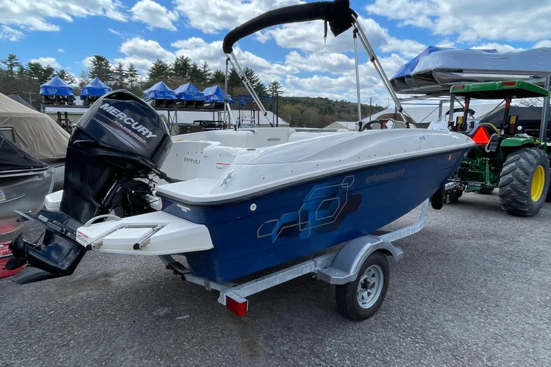 Slide: The Image of 2019 Bayliner Element E16 boat with Mercury outboard motor on trailer. - 17