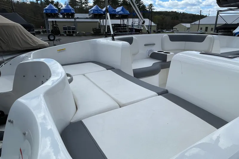Slide: The Image of 2019 Bayliner Element E16 boat interior with white and gray seating. - 20