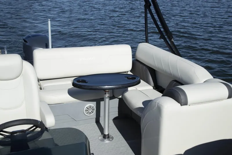 Slide: The Image of Manufacturer Provided Image: 2022 Sylvan Mirage X X3 CLZ pontoon boat interior with seating and table on water. - 13