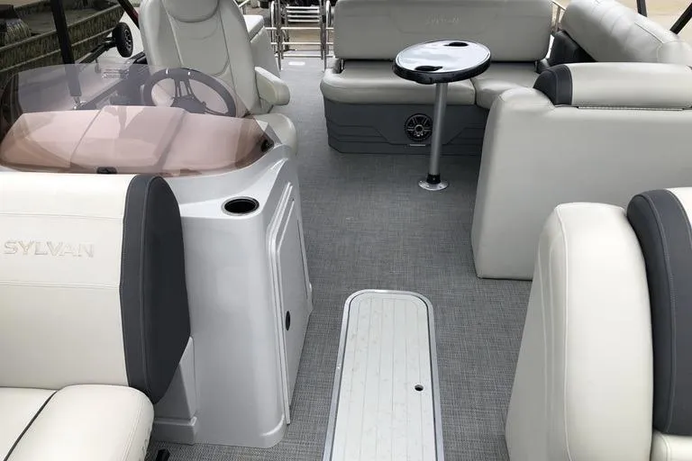 Slide: The Image of 2022 Sylvan Mirage X X3 CLZ boat interior with plush seating and modern design. - 2