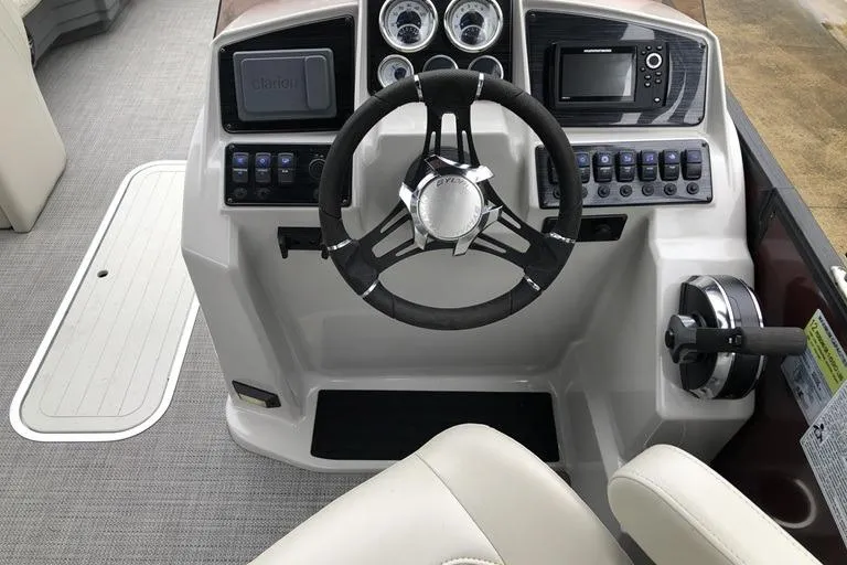 Slide: The Image of Cockpit of 2022 Sylvan Mirage X X3 CLZ pontoon boat with steering wheel and controls. - 3